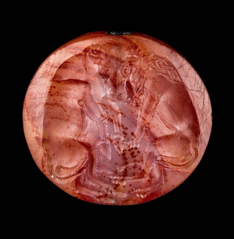 Lentoid seal with a lion attacking a bull