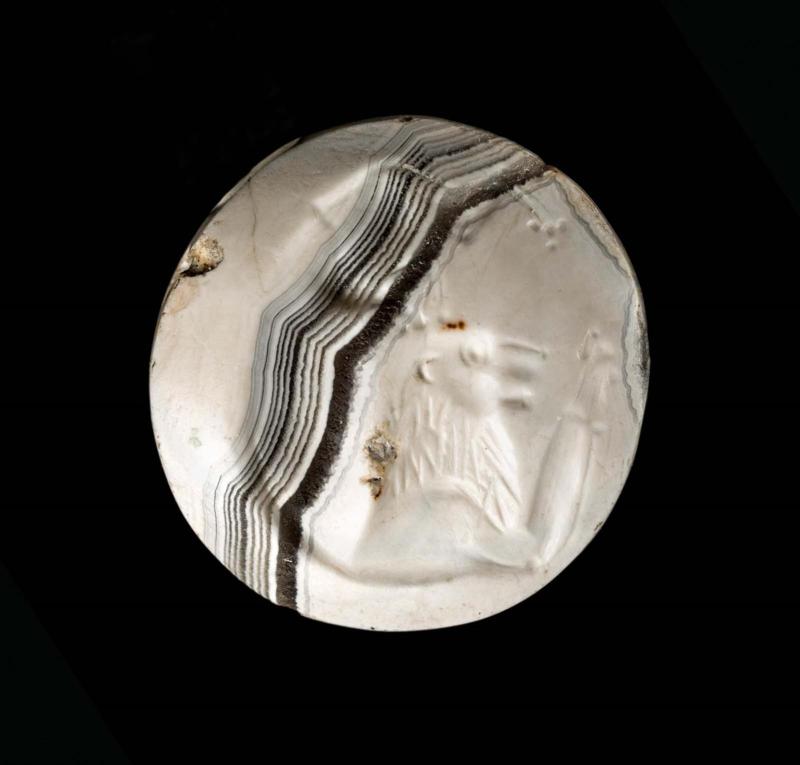 Lentoid seal with a lion scratching his head