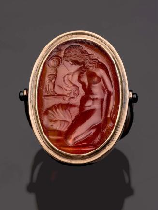 Oval gem with Kassandra kneeling at Palladion