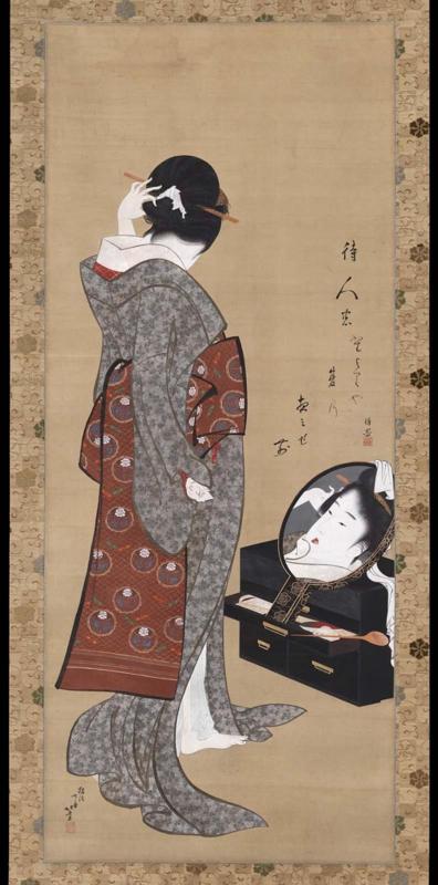Woman Looking at Herself in a Mirror