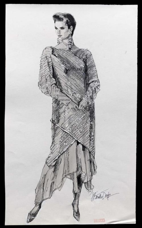 Model in dress and wrap with assymmetric hems