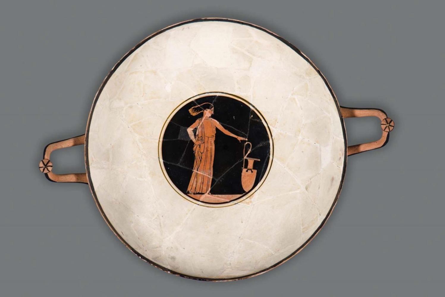 Drinking cup (kylix) depicting a woman with a water jar
