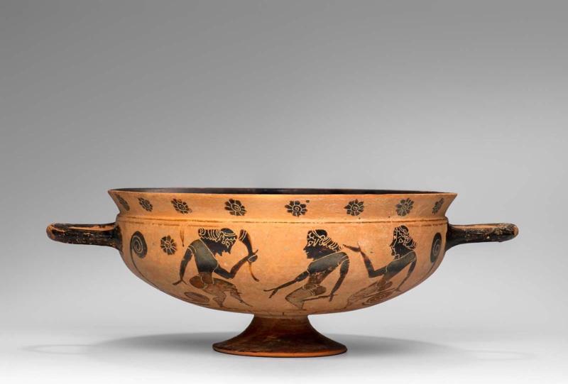 Drinking cup (kylix) with Komasts dancing