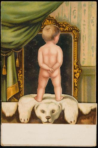 Naked boy looking in a mirror