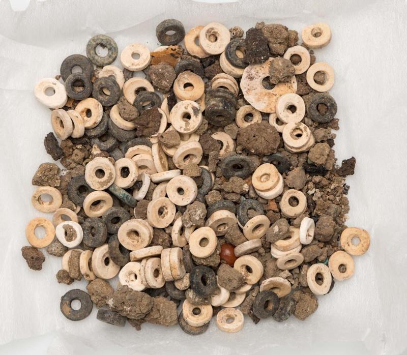 Beads and leather fragment