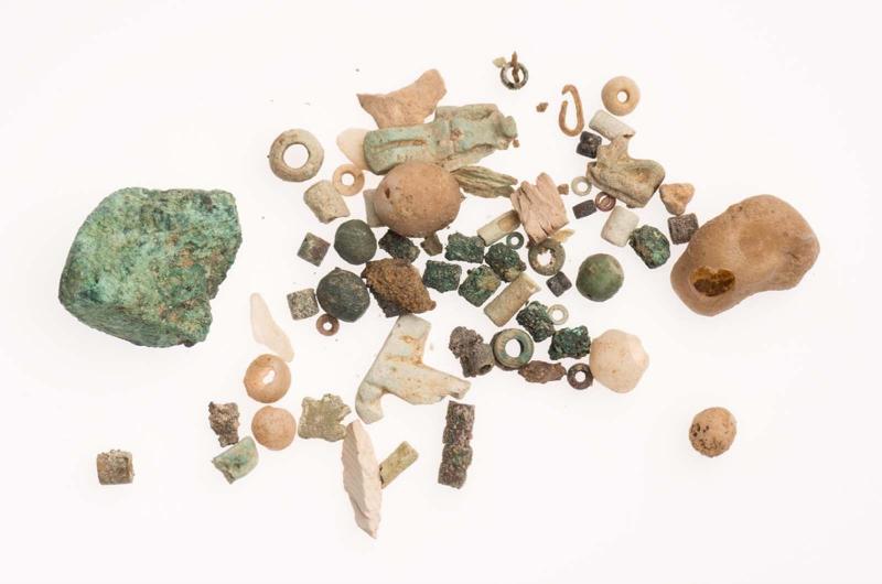 Beads, fragments of stone, and amulet