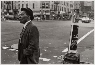 A Man on the Corner of Lenox and 125th Street