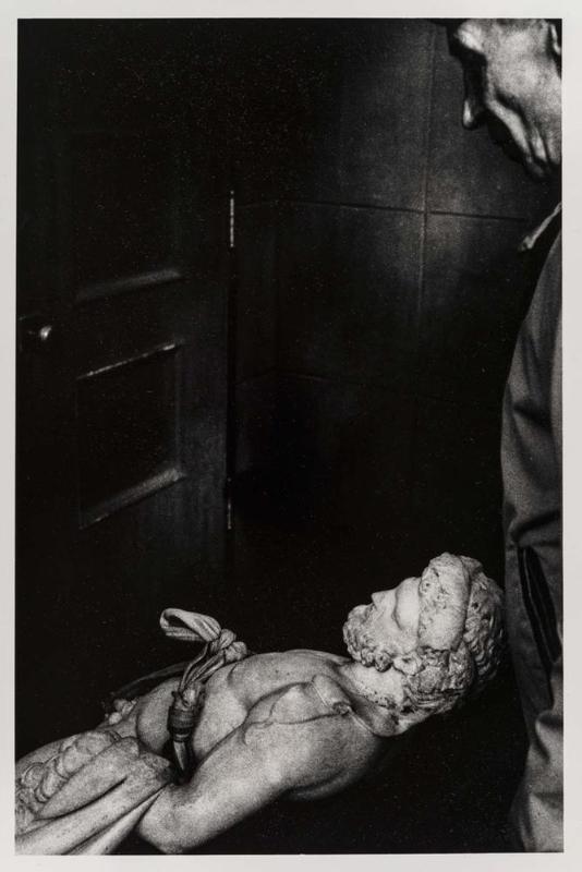 Untitled (Man Moving Statue)