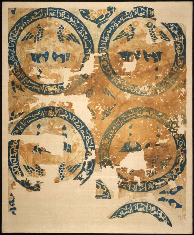 Textile fragment with paired birds and deer