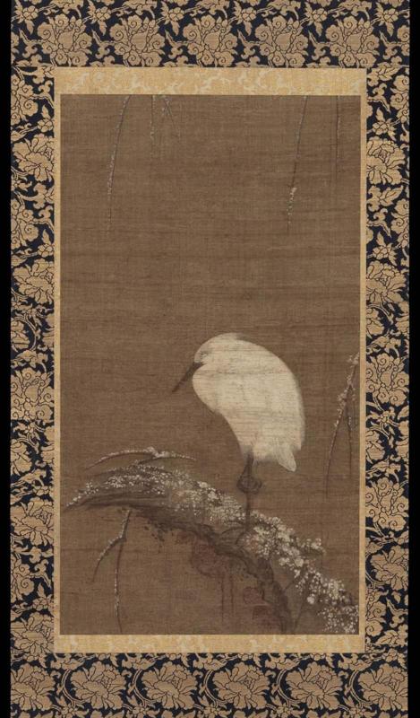 White heron on a snow-covered willow
