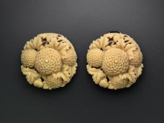 Two part belt buckle depicting chrysanthemums