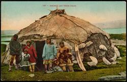 549 -- ESKIMOS AND THEIR IGLOO.