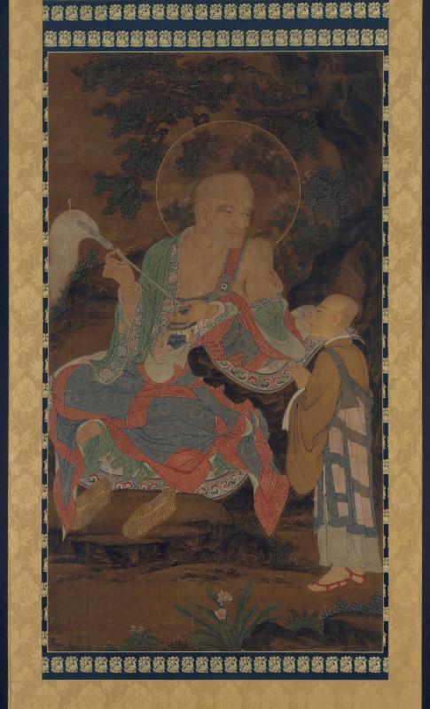 Luohan holding a fly whisk with a monk