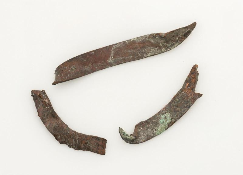 Three fragments of copper strips