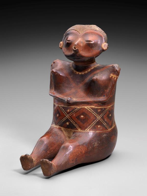 Seated female effigy figure