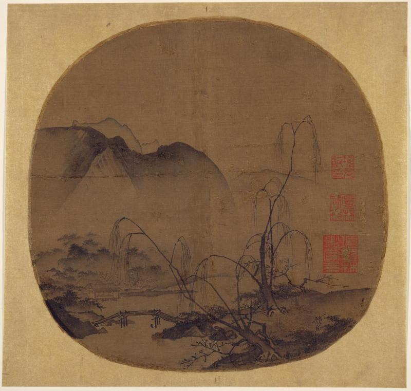 Bare willows and distant mountains