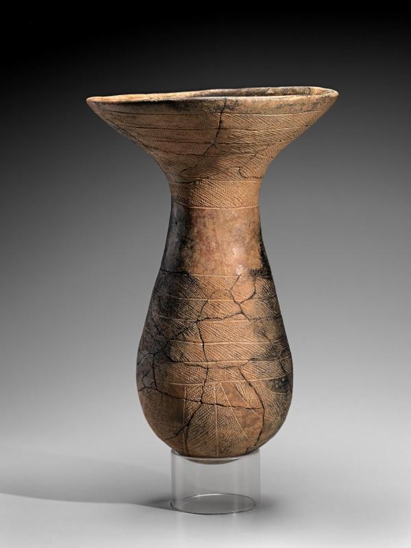 Caliciform beaker with incised and impressed decoration