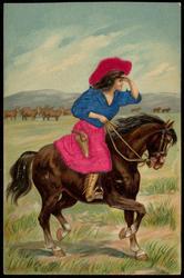 Woman on horseback looking out over the plains.
