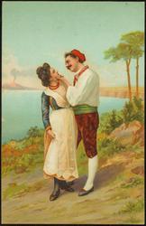 Portrait of man and woman dancing / frolicking by the sea.
