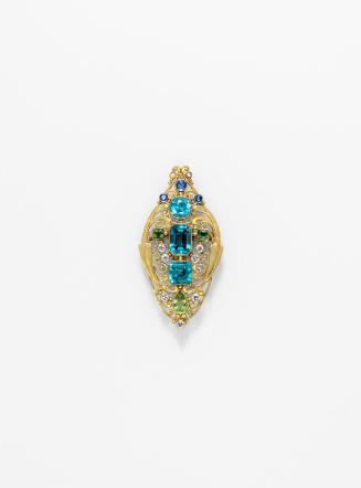 Jeweled scroll brooch