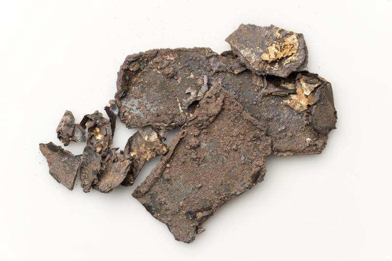 Nine fragments of gilded silver