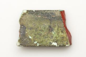 Fragment of red glass