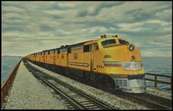 STREAMLINER "CITY OF SAN FRANCISCO" CROSSING GREAT SALT LAKE  This sleek streamliner operates on a fast, daily schedule via North Western - Union Pacific - Southern Pacific between Chicago and San Francisco. It is the "last word" in travel comfort, offering coach and all types of sleeping car accommodations, dining cars and lounge cars.
