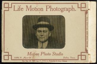 Life Motion Photograph. [Man with a hat on]