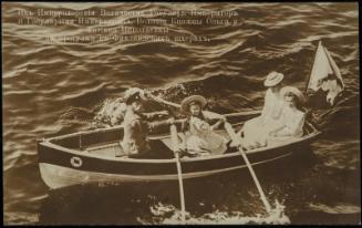 The Emperor of Russia, his wife and two daughters rowing a boat.