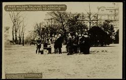 PRES. WILSON TALKING TO AEROPLANE PILOT OVER WIRELESS TELEPHONE
