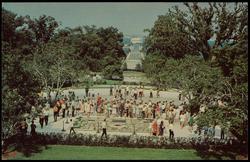 Grave of John F. Kennedy, the 35th President of the United States, overlooking the Nations Capital from Arlington Cemetery. The eternal flame, lighted during the burial service is located in front of the Presidential Seal.