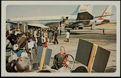 No. 3, President John F. Kennedy and party leaving airplane at Love Field. (Mrs. Kennedy — pink hat.)