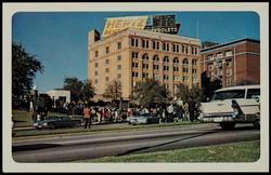 No. 12, Texas School Book Depository building from which authorities believe fatal shots were fired. (Note second window down on right corner of building.)