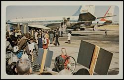 No. 3, President John F. Kennedy and party leaving airplane at Love Field. (Mrs. Kennedy — pink hat.)