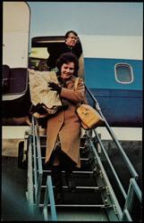 Rosalynn and Jimmy Carter carry their own gear! Democratic Carters arrive on January 19, 1977, for inaugural next day.