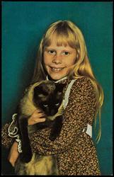 Amy Carter, President Jimmy's daughter, all dressed up and holding her beautiful Siamese cat, Misty Malarkey Ying Yang.