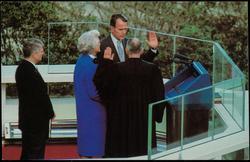 The oath of office is administered to Vice-President George Bush by the Honorable Potter Stewart, Associate Justice of the Supreme Court, as Mrs. Bush observes.