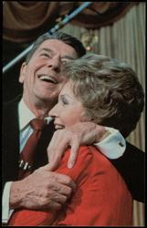 During a new surge in his popularity, "The Only President to Get Younger in Office," announced from the Oval Office on Sunday night, February 4, 1984 that he would run for re-election. His long-term goals included a 10-year goal to orbit a manned space station, and a meeting with Congressional Democrats to agree on a three-year, $100 billion deficit-reduction package. Nancy radiates her happiness over his decision and unabashedly gave him a kiss for the cameras.