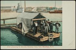 Diver preparing to descend, Brooklyn Navy Yard. Brooklyn, N.Y.
