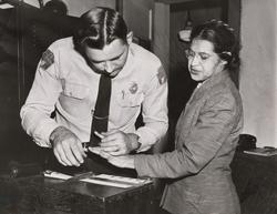 Rosa Parks being fingerprinted, Montgomery, Alabama
