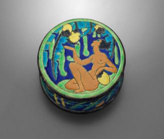 Covered box with reclining figure