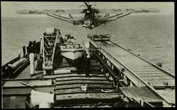 Aeroplane taking off from motor ship. "Schwahenland", Germany's floating island. [written in pencil on verso]