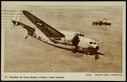 Canadian Air Force Bomber circling a mine sweeper.