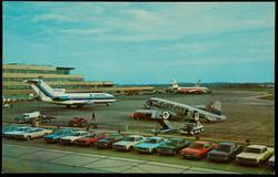 A scene at the Greater Pittsburgh Airport, Pittsburgh, Pa., in which planes of Eastern, TWA and Lake Central Airlines are featured,