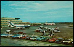 A scene at the Greater Pittsburgh Airport, Pittsburgh, Pa., in which planes of Eastern, TWA and Lake Central Airlines are featured.