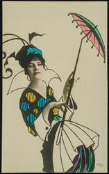 Woman in blue and yellow polka dots with a parasol.