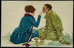Woman in blue feeding a man with her hand.