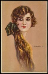 Portrait of a glamorous woman with a red bow.