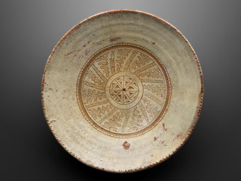 Glazed dish with geometric and scrollwork designs