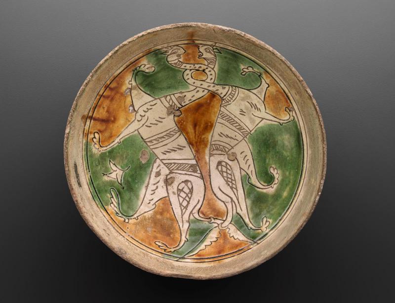 Glazed bowl with snake-shaped head creatures